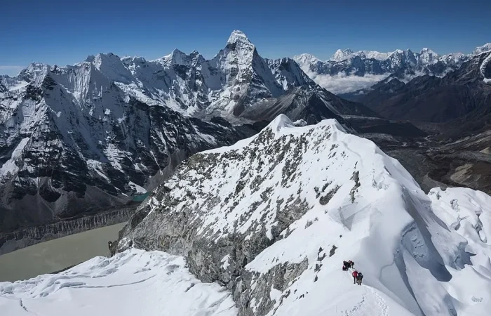 a group of people climbing a mountain