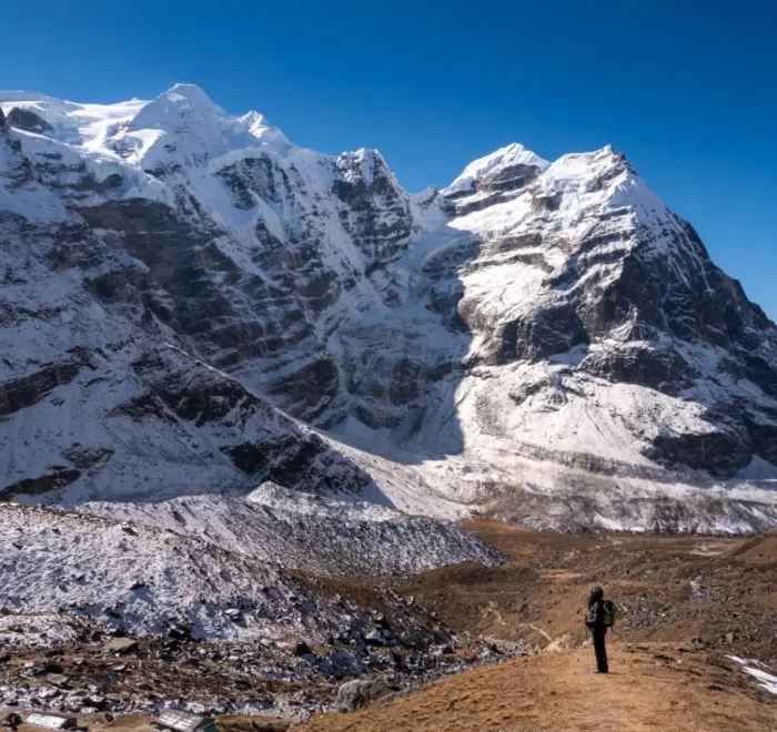 a person standing on a mountain