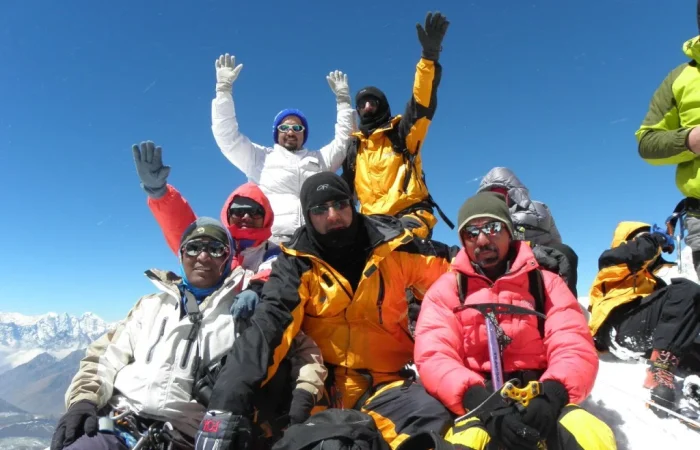 Island Peak climbing: a group of people in ski gear on a mountain
