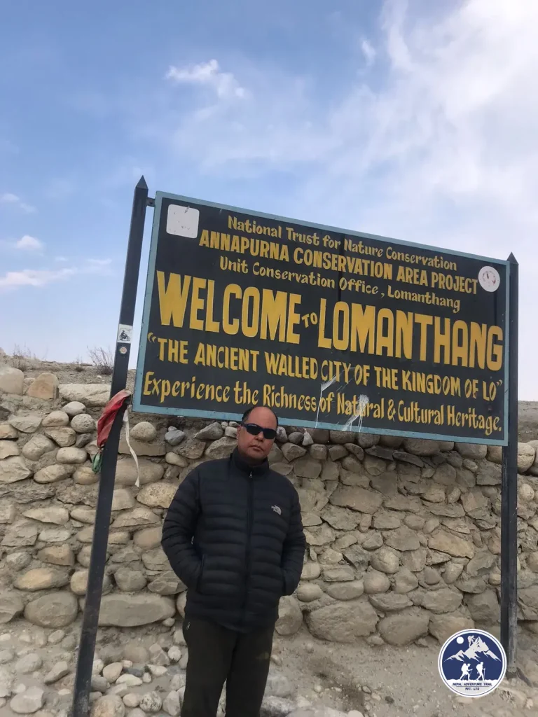 a man standing in front of a sign