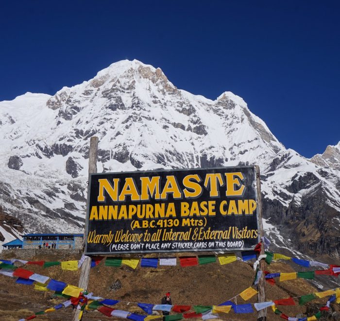 Snowy mountains with welcome sign.