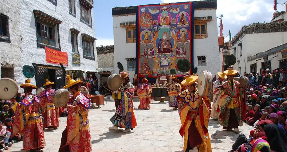 Masked dancers performing at the Tiji Festival in Lo Manthang, Upper Mustang, honoring the legacy of the Lomanthang King