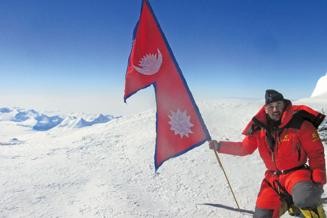 Mount Everest peak with Nepali flag waving proudly, symbolizing Nepal as the Himalayan country of courage and adventure.
