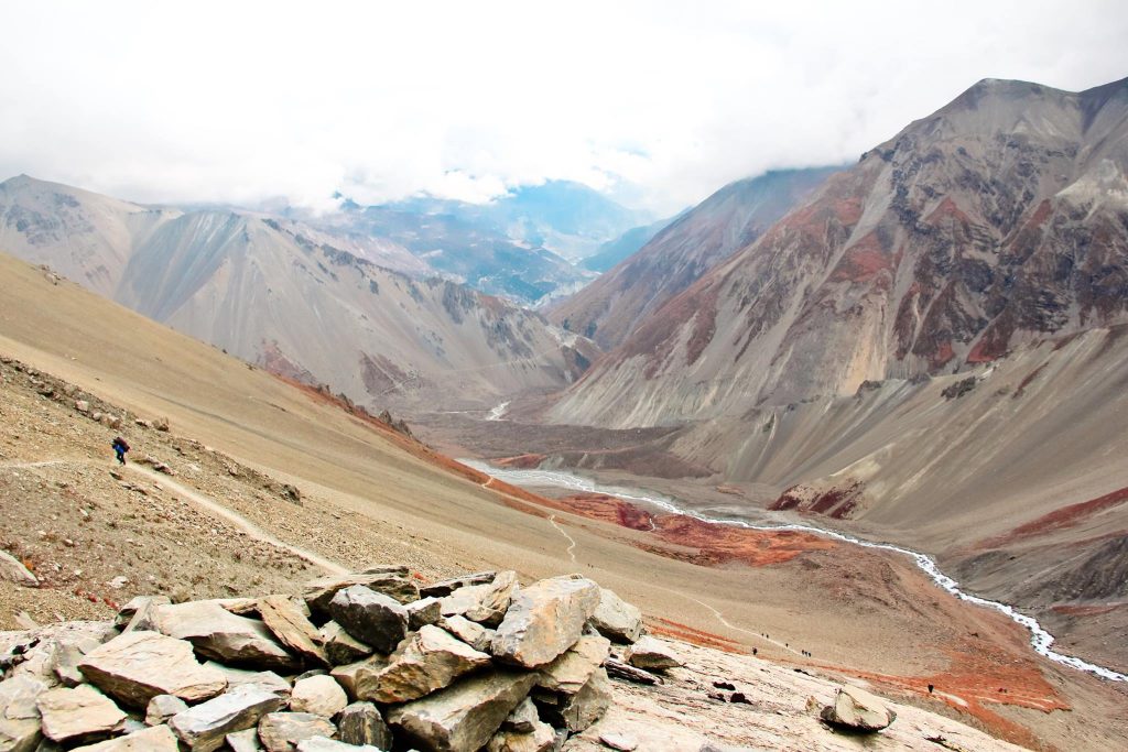 View of Manang Valley on Nepal's Annapurna Circuit, where the Marsyangdi River meanders between craggy hills.