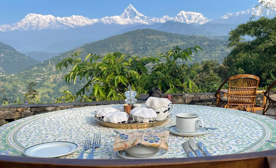 Mountain view dining table at Tiger Mountain Lodge Pokhara, one of the best luxury yoga retreats Nepal offers