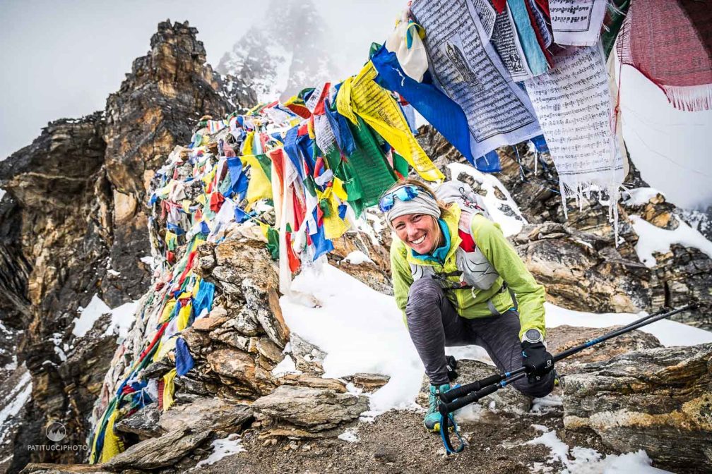 Lady trail runner in the Himalayas exploring the best trail running routes and altitudes in Nepal