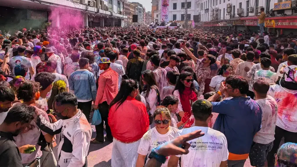 People enjoying Holi during a Kathmandu Festival Tour, celebrating the festival of colors with locals in the streets of Kathmandu
