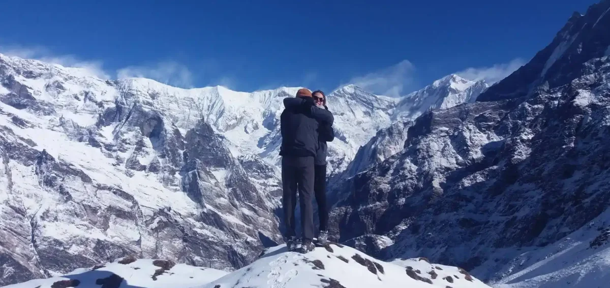 Travellers at the Mardi Himal Viewpoint with panoramic Himalayan mountain views