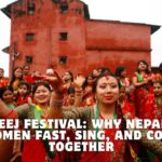 Nepali women dancing and celebrating in traditional red saris during the Teej festival.