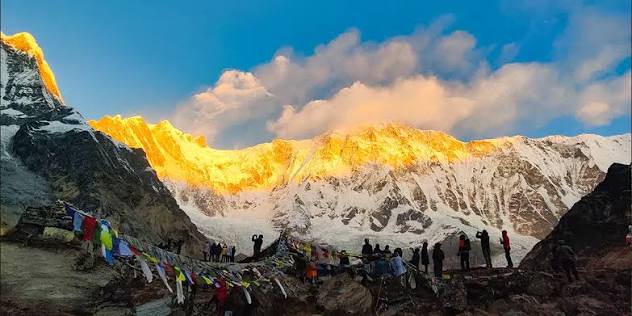 Snow-capped Himalayan peaks towering above an alpine trail during trekking in Nepal for beginners.