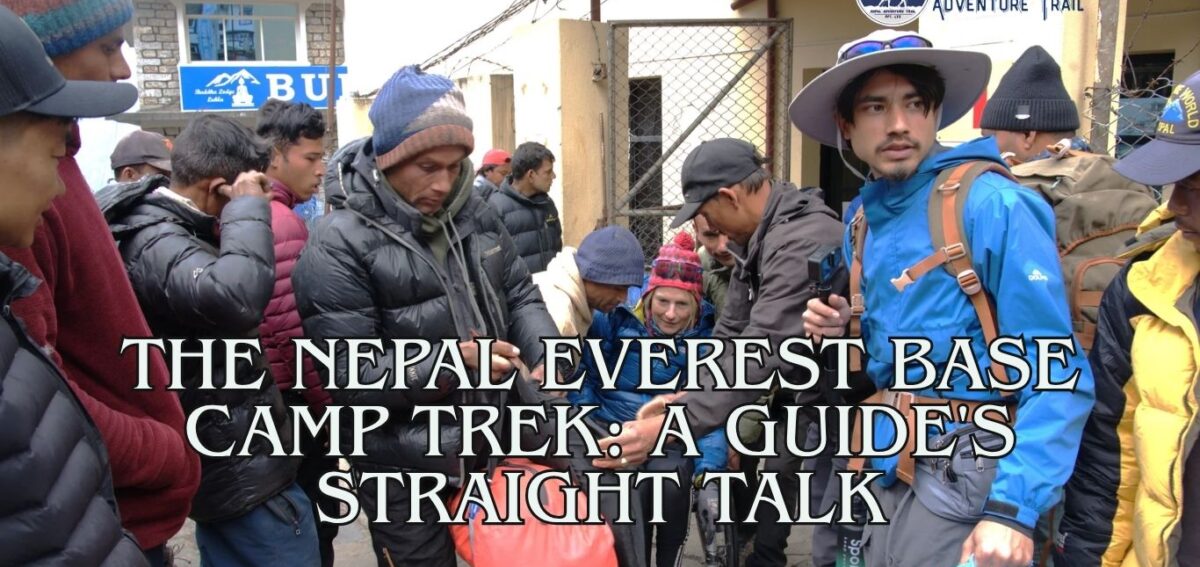 Mountain guide at Lukla airport starting Everest Base Camp trek Professional mountain guide checking trekker equipment at the Lukla airport before starting the Nepal Everest Base Camp trek.