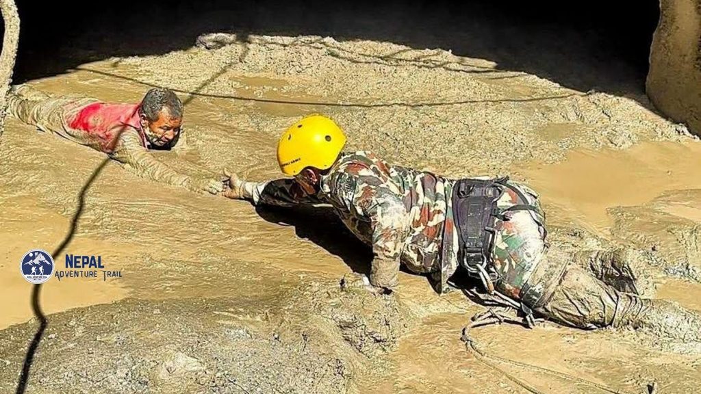 Nepal Army personnel conducting rescue and relief operations along the debris-strewn riverbanks in Rasuwa following the flash flood.