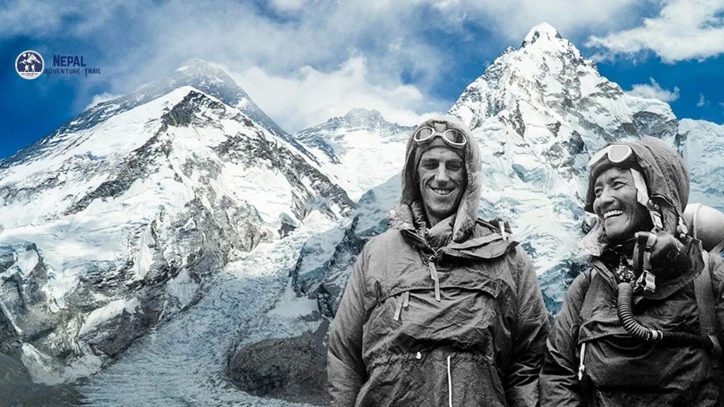 A black-and-white historical photograph of mountaineers Tenzing Norgay and Sir Edmund Hillary smiling side by side at an expedition camp in front of snow-covered Himalayan peaks, showcasing key figures about mount everest history.