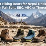 Six different hiking boots (L-R: green, brown leather, black/yellow, blue, tan leather, yellow/red) are lined up on a rocky trail in the Himalayas. Ama Dablam mountain is prominent in the background with prayer flags and other trekkers visible. The image title is displayed in white text at the top.
