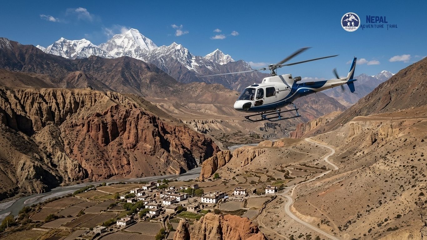 mustang helicopter nepal Aerial view from a Mustang Helicopter Tour Nepal flying over the arid, red rock canyons and traditional villages of Upper Mustang with the snow-capped Himalayan peaks in the background.